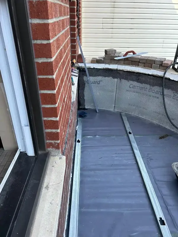 Exterior balcony waterproofing with cement board and metal framing