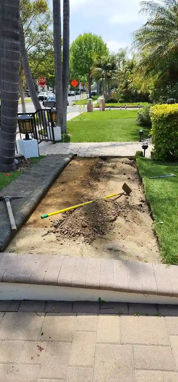 Front yard excavation trench for paver walkway renovation in Brooklyn NY by DJ Luxury Renovations